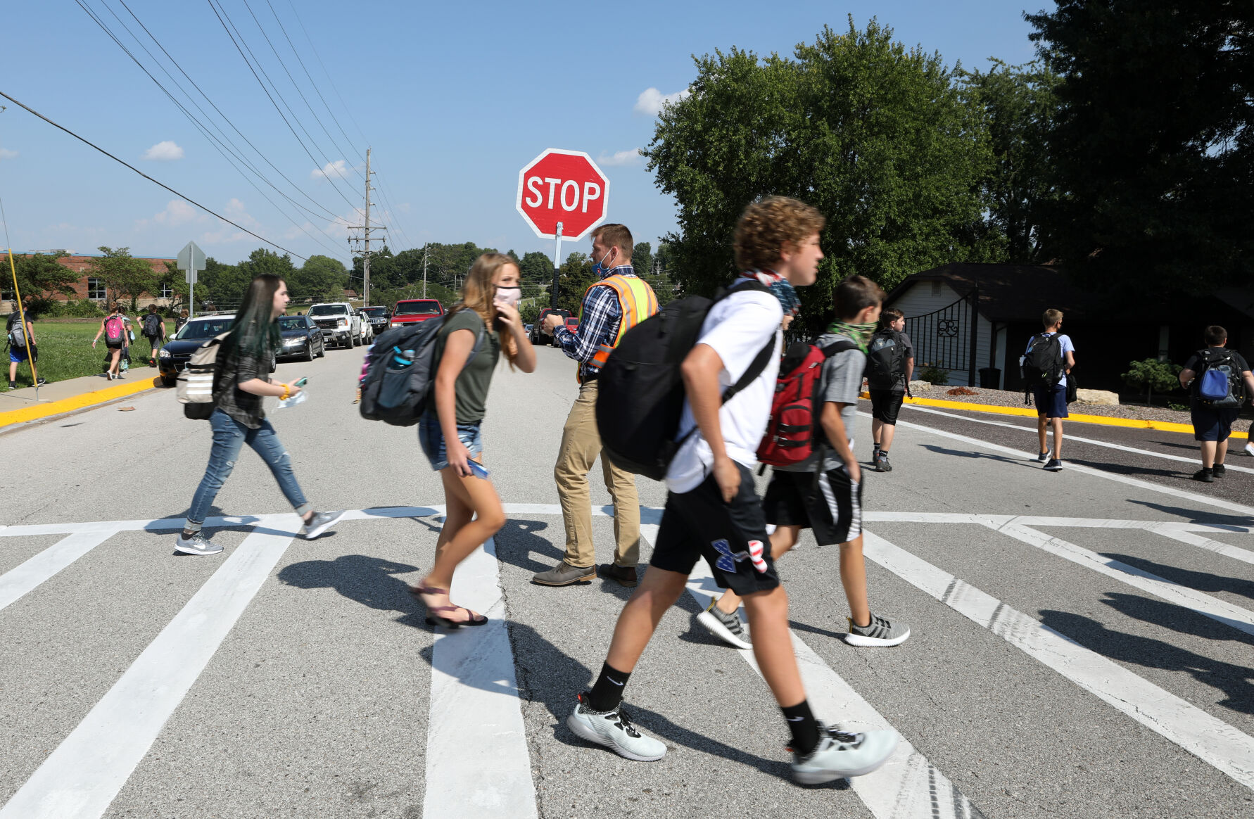 Kyle Summers holds a stop sign
